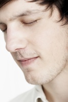 Young man with eyes closed, imagining